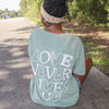 NEW! | "LOVE NEVER GIVES UP" PREMIUM COMFORT COLOR TEE | BAY