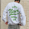 NEW! | "LOVE NEVER GIVES UP" CREWNECK | ASH